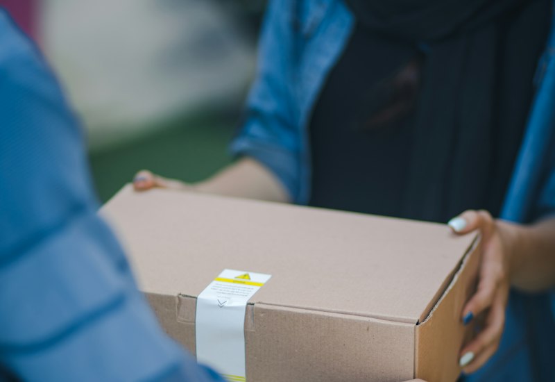 Package being handed over at the door