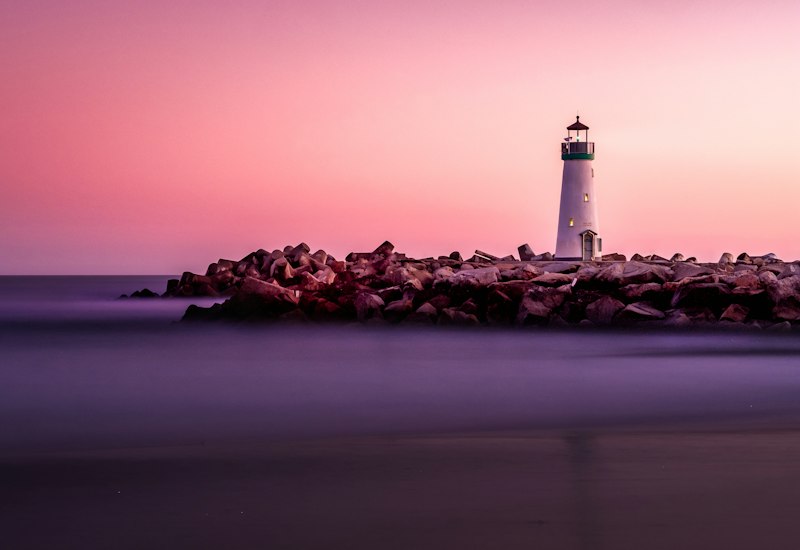 White lighthouse on the shore